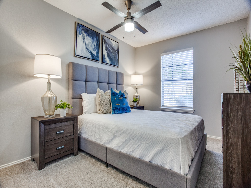 model bedroom with carpet and modern furniture and ceiling fan